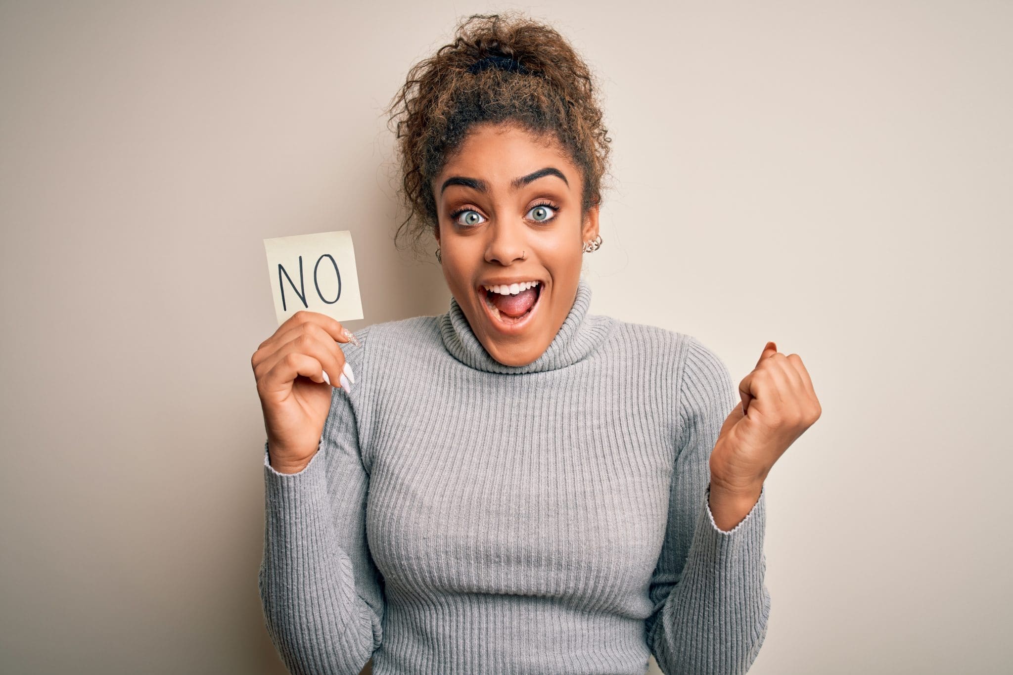 Young african american girl holding reminder paper with no word negative message screaming proud and celebrating victory and success very excited, cheering emotion