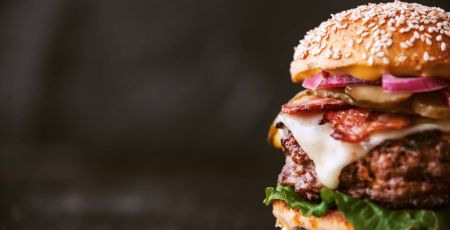 a delicious and juicy burger home in a rustic style with a big chop of beef