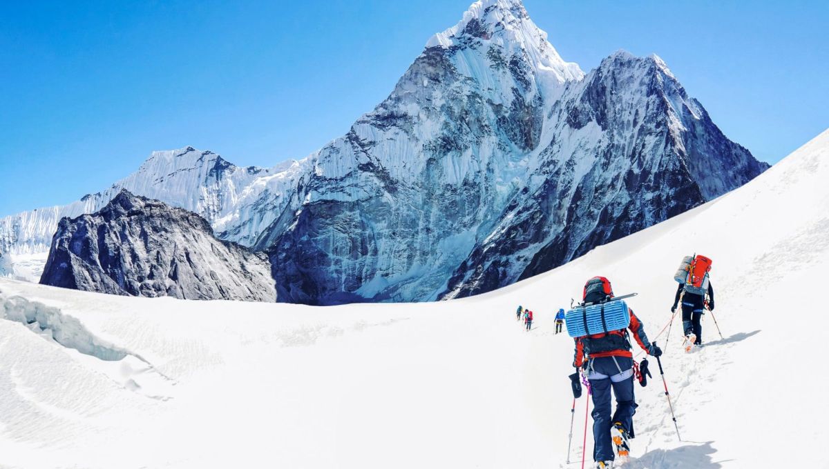 Group of climbers reaching the Everest summit in Nepal. Team work concept.