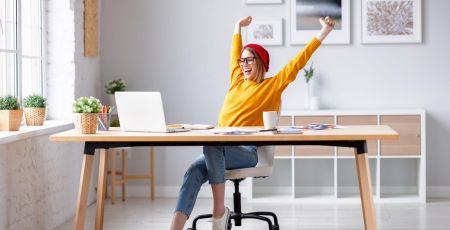 Happy female designer finishing work