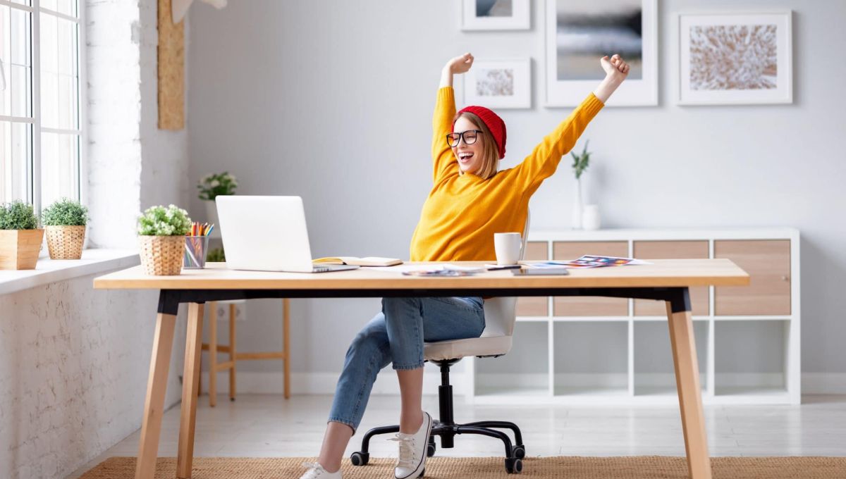 Happy female designer finishing work
