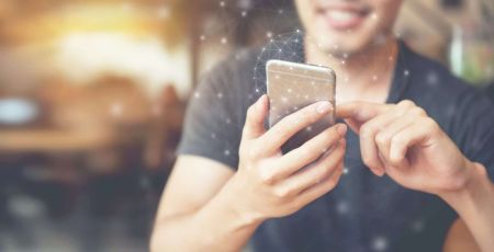 Man hand using mobile phone, Worldwide connection technology interface.