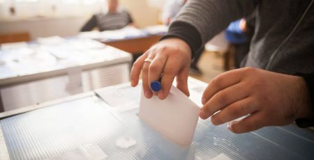 Person voting at polling station