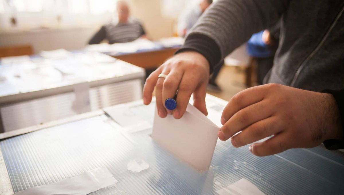 Person voting at polling station