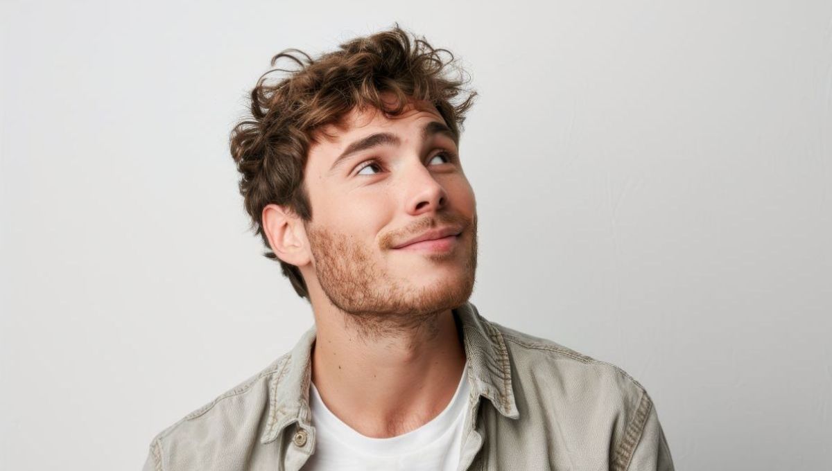 Portrait of a happy European man dressed casually looking satisfied and smiling noticing something in the distance